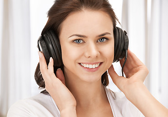 Image showing happy teenage girl in big headphones