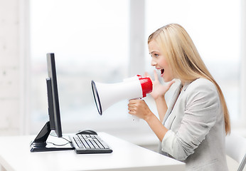 Image showing strict businesswoman shouting in megaphone