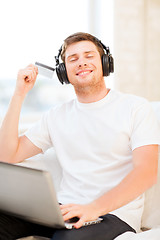 Image showing man with headphones listening to music