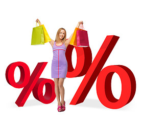 Image showing woman with shopping bags and percent signs