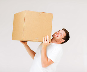 Image showing man carrying carton heavy box