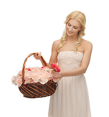 Image showing woman with basket full of flowers