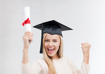 Image showing student in graduation cap with certificate