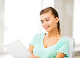 Image showing smiling student girl with tablet pc