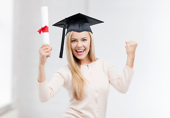 Image showing student in graduation cap with certificate