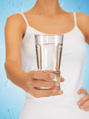 Image showing woman hands holding glass of water