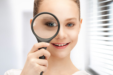 Image showing teenage girl with magnifying glass