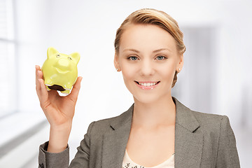 Image showing lovely woman with piggy bank