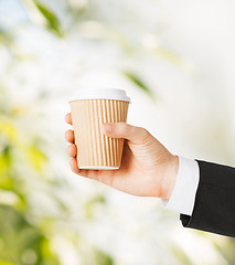 Image showing man hand holding take away coffee