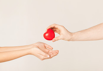 Image showing woman and man hands with heart