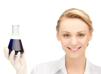 Image showing female chemist holding bulb with chemicals