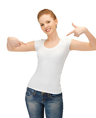 Image showing woman in blank white t-shirt pointing at herself