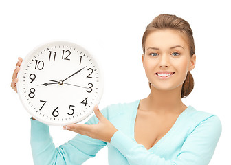 Image showing woman with wall clock