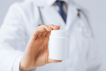 Image showing doctor hands holding white pack