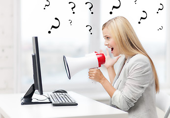 Image showing strict businesswoman shouting in megaphone