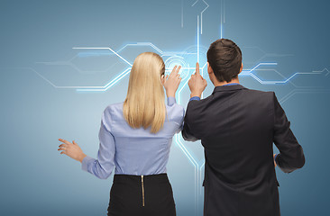 Image showing man and woman working with virtual screen