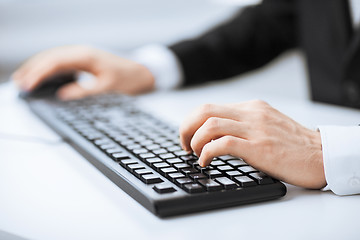 Image showing man hands typing on keyboard