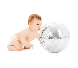 Image showing child playing with disco ball