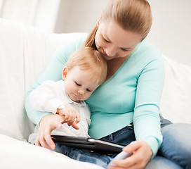 Image showing mother and adorable baby with tablet pc