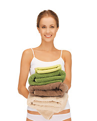 Image showing lovely housewife with towels