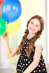 Image showing happy girl with colorful balloons