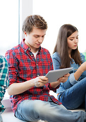 Image showing student looking into tablet pc at school