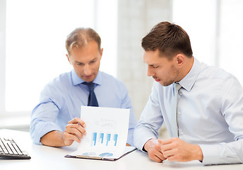 Image showing businessmen with notebook on meeting