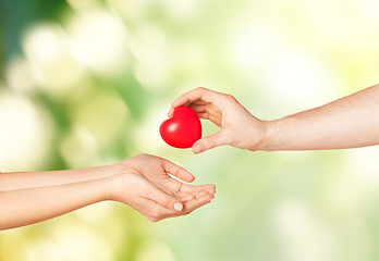 Image showing woman and man hands with heart