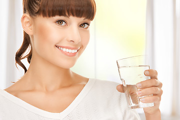 Image showing young smiling woman with glass of water