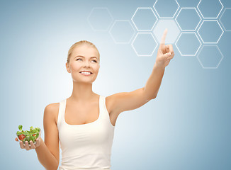 Image showing woman with salad and virtual screen