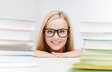 Image showing student with stack of books