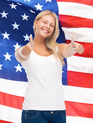 Image showing teenage girl in blank white t-shirt with thumbs up