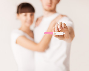 Image showing woman and man hands with pregnancy test