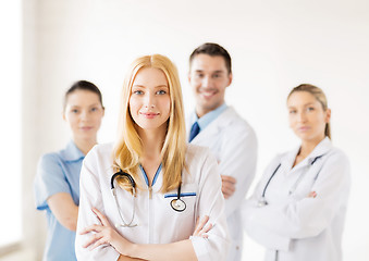 Image showing female doctor in front of medical group