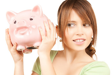 Image showing lovely girl with big piggy bank