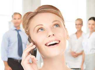 Image showing businesswoman with cell phone calling