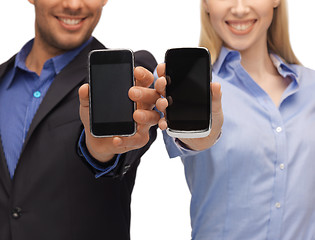 Image showing woman and man hands with smartphones