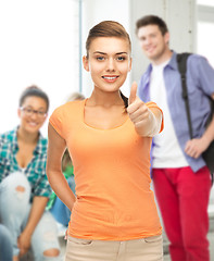 Image showing woman showing thumbs up at school