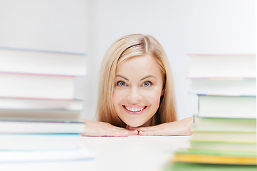 Image showing student with stack of books