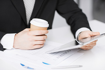 Image showing man with tablet pc and cup of coffee