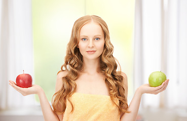 Image showing young beautiful woman with green and red apples