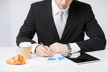 Image showing man with tablet pc and cup of coffee