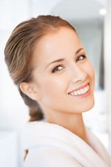 Image showing beautiful woman in white bathrobe