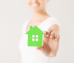 Image showing woman hands holding green house