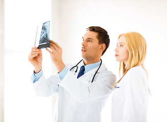 Image showing two doctors looking at x-ray