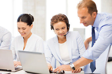 Image showing group of people working in call center