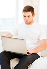 Image showing man working with laptop at home