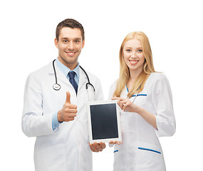Image showing young doctors holding tablet pc in hands