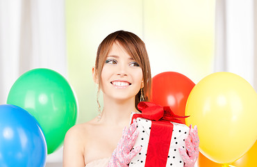 Image showing party girl with balloons and gift box