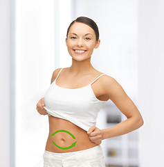 Image showing woman with arrows on her stomach